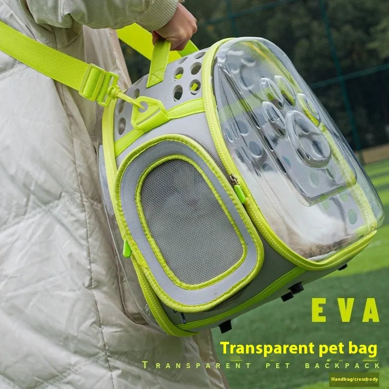 Transparent hard EVA space capsule backpack for cats, shown in green, with shoulder straps and large viewing window.