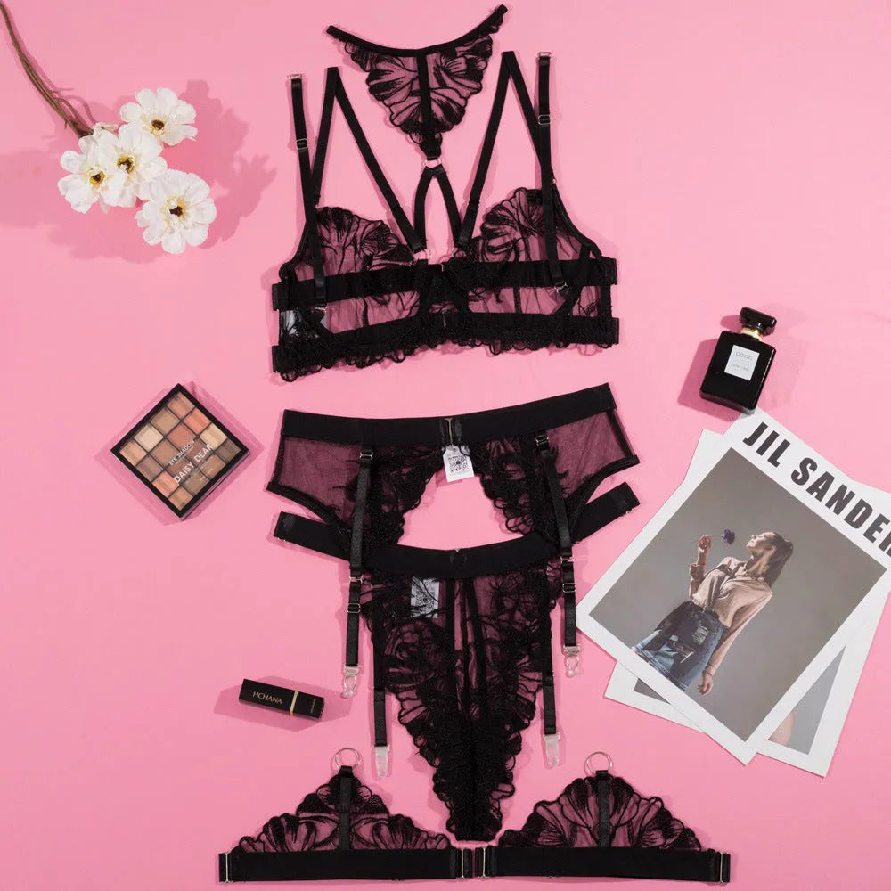 Black women's three-piece lingerie set with embroidery stitching on mesh fabric