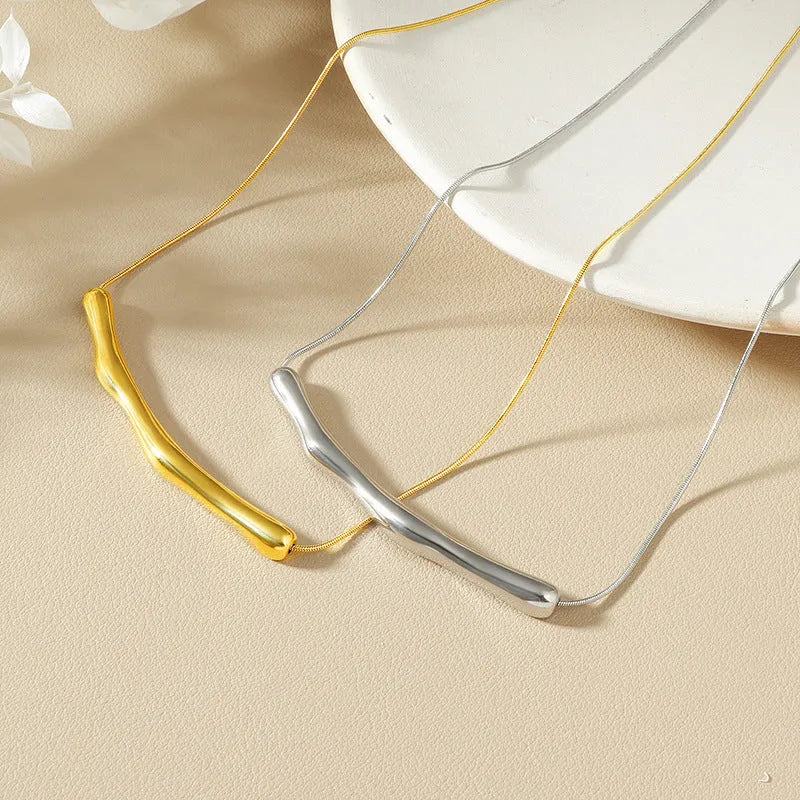 Gold and steel coloured irregular pleated titanium steel necklace for women.