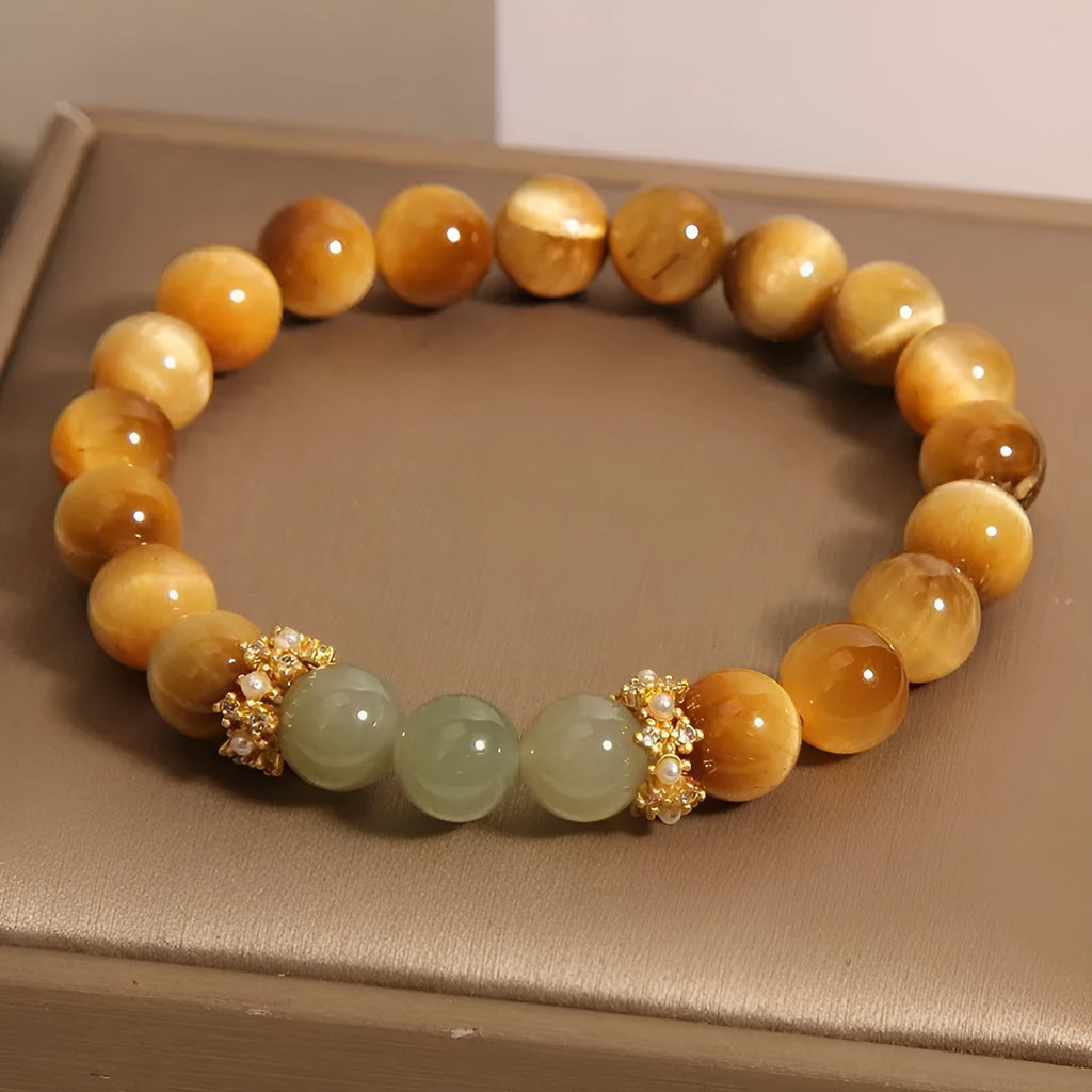 Natural yellow tiger's eye and Hetian jade bracelet with U-shaped bead design showing golden gourd pattern
