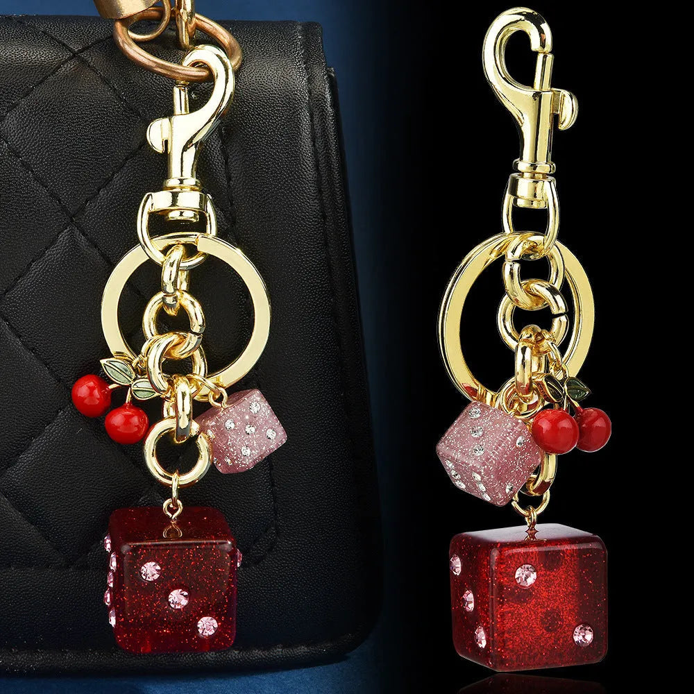 Cherry two-tone dice keychain pendant with square pattern metal design