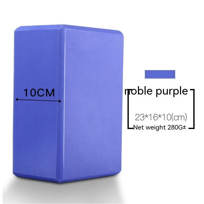 High-density EVA yoga block in violet colour next to a pink block with a cartoon print design.