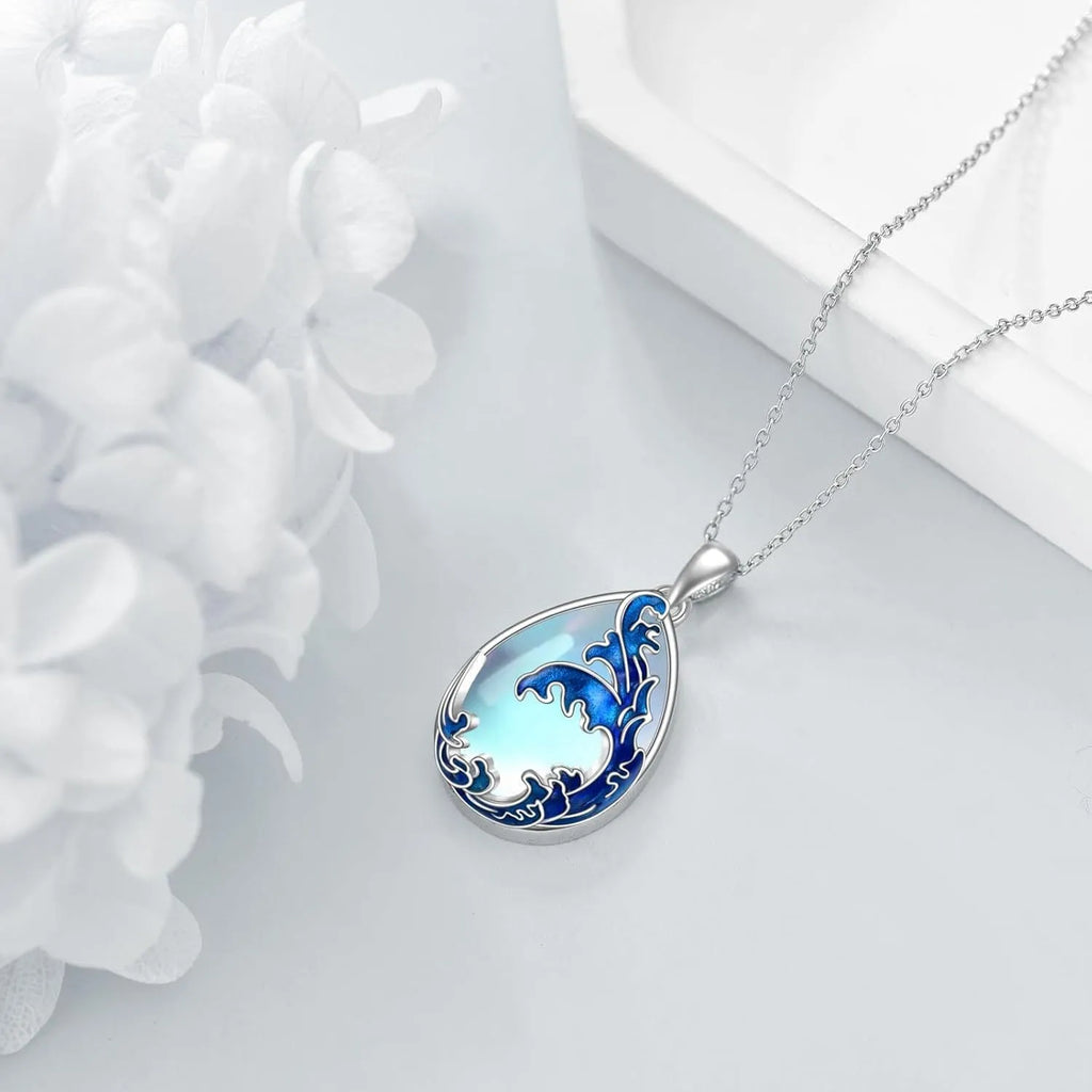 Blue heart-shaped alloy pendant necklace on a silver-tone chain.