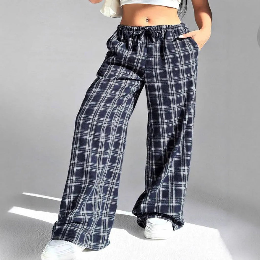 Women's loose fit plaid trousers with drawstring waist and side pockets in red and blue colours
