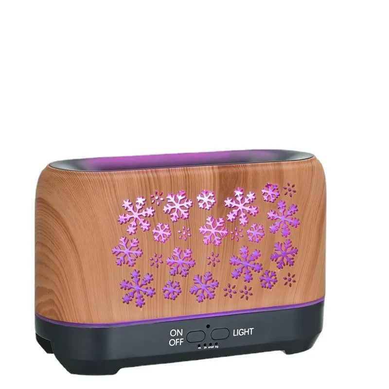 Colourful snowflake wood grain aromatherapy humidifier with flame effect lighting on a desktop