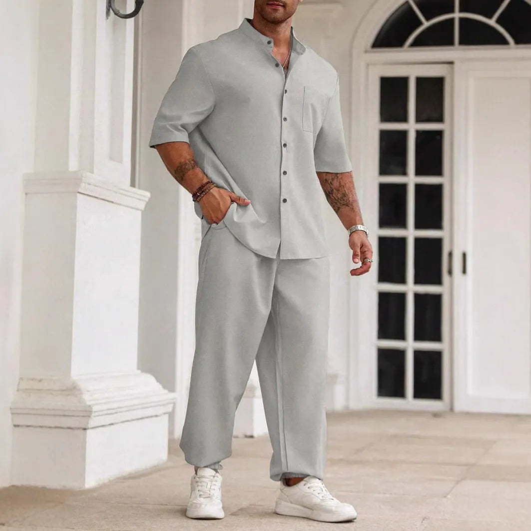 Men's casual apricot-coloured cotton linen short-sleeve shirt and trouser set laid flat.