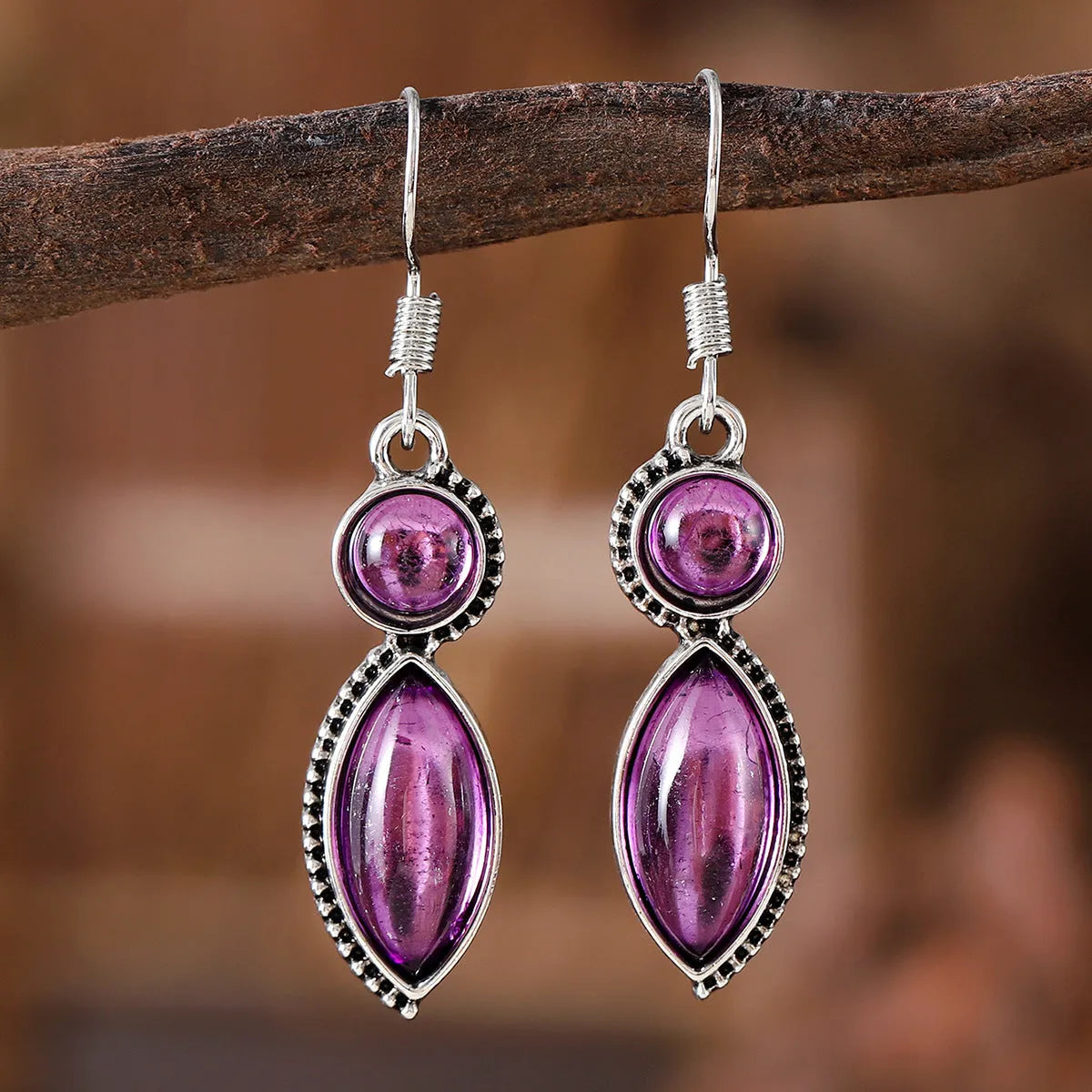 Geometric vintage pendant earrings with black and purple electroplated finish and round elements