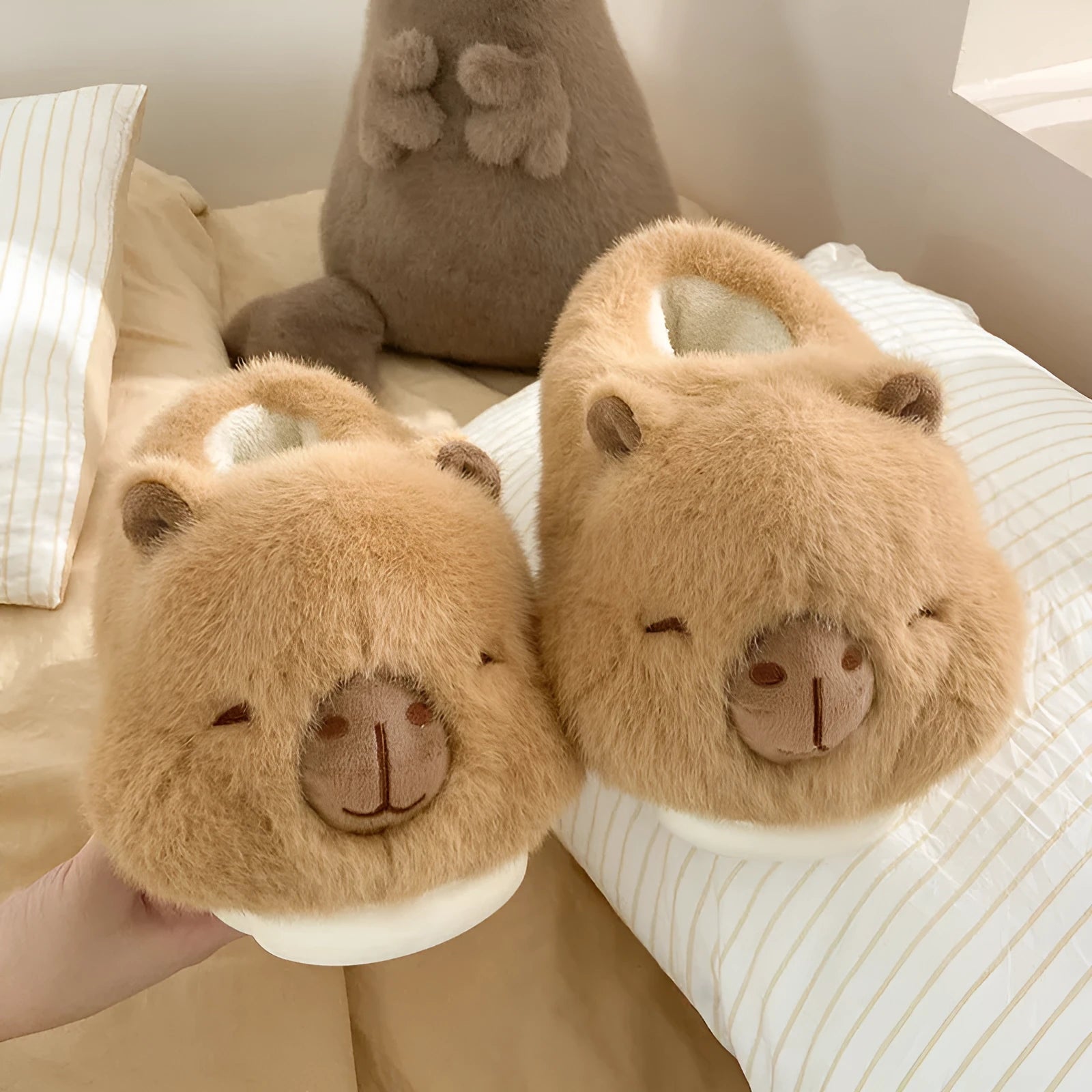Light brown plush women's winter slippers with artificial wool lining and a round toe.