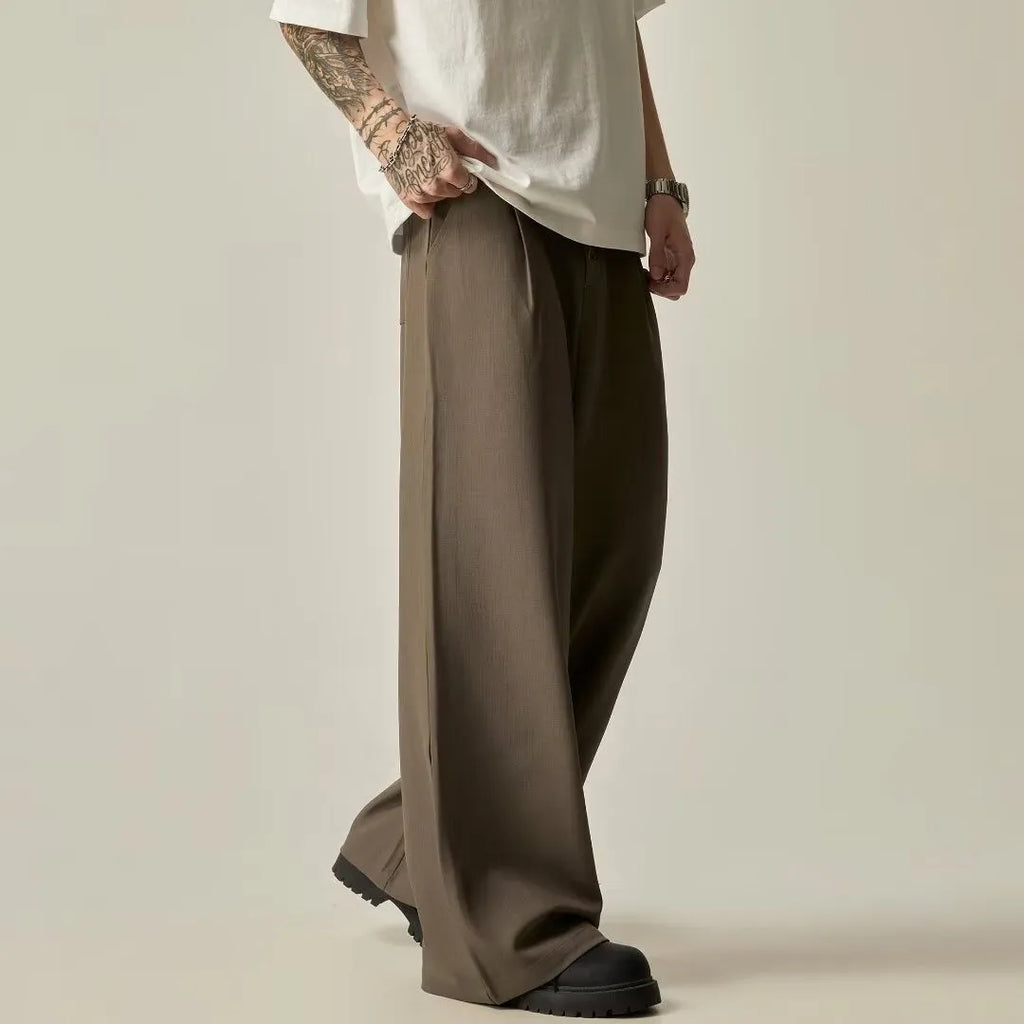 Men's black wide-leg tube trousers with button fly and straight-leg design on hanger