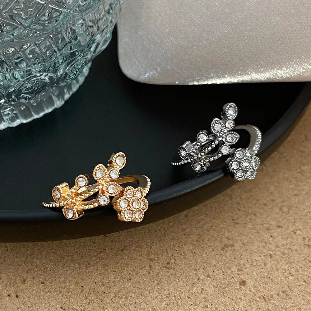 Women's open ring with diamond-treated flower and leaf designs on copper in gold colour option