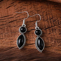 Geometric vintage pendant earrings with black and purple electroplated finish and round elements