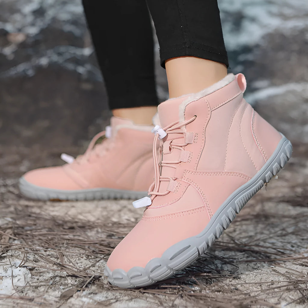 A pair of waterproof fleece-lined outdoor snow boots with a round toe, front laces, and a rubber sole.