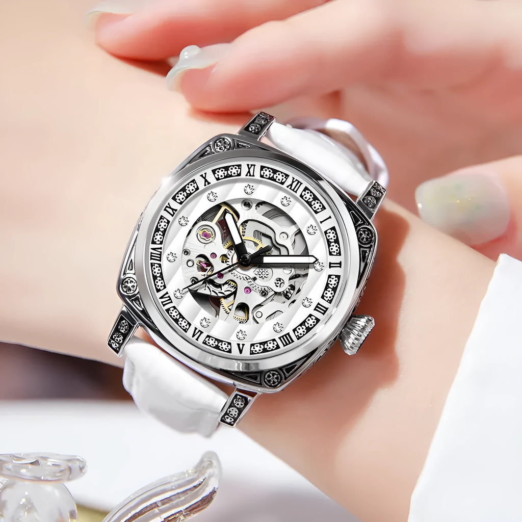 Leather strap mechanical watch with luminous hands on a wrist, showing black dial variant.