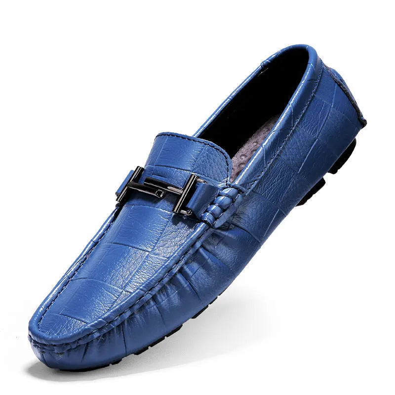 Men's brown leather casual loafers with a silver buckle on the front, shown from a side angle.