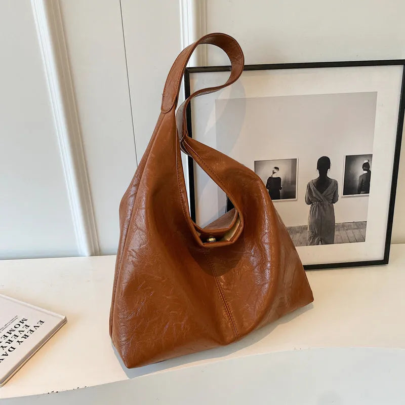 Casual soft leather shoulder bag with sandwich pockets in various colour options