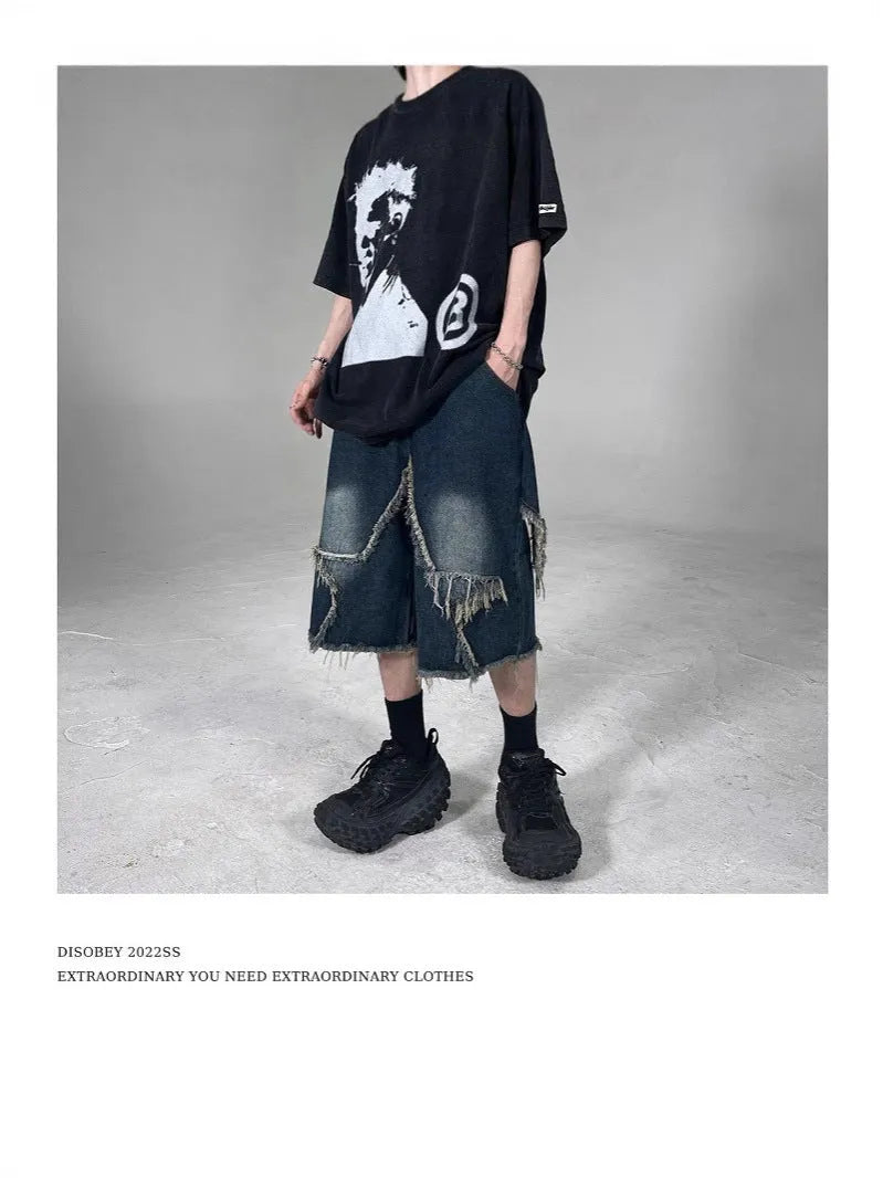 Blue denim shorts with five-pointed star detailing and frayed edges in loose fit style