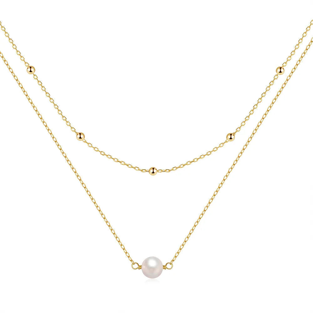 S925 sterling silver double layer necklace with twin pearls on a geometric pendant, shown in gold and white gold finishes.