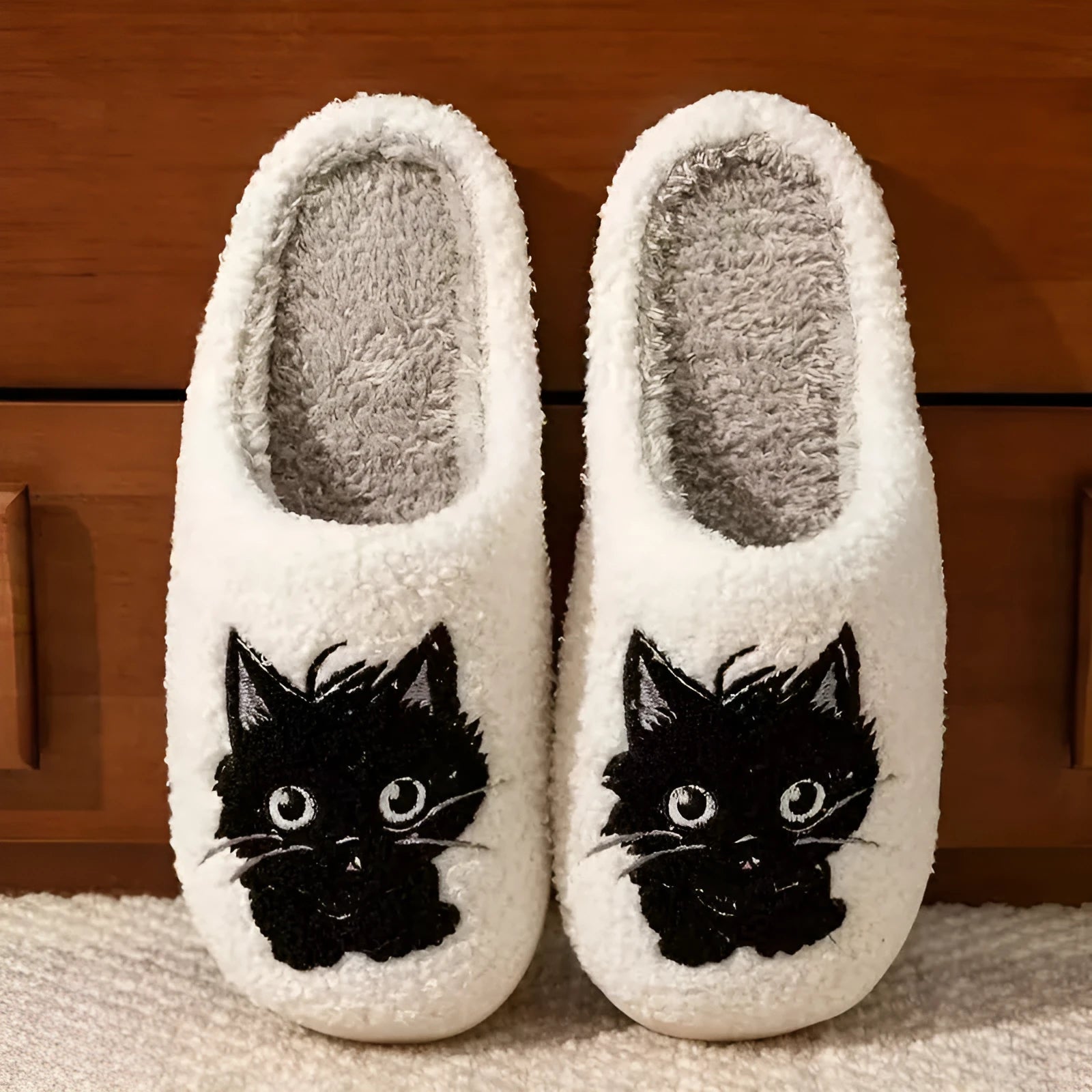 White plush slippers with Black Beard cat cartoon design for couples, showing non-slip sole.