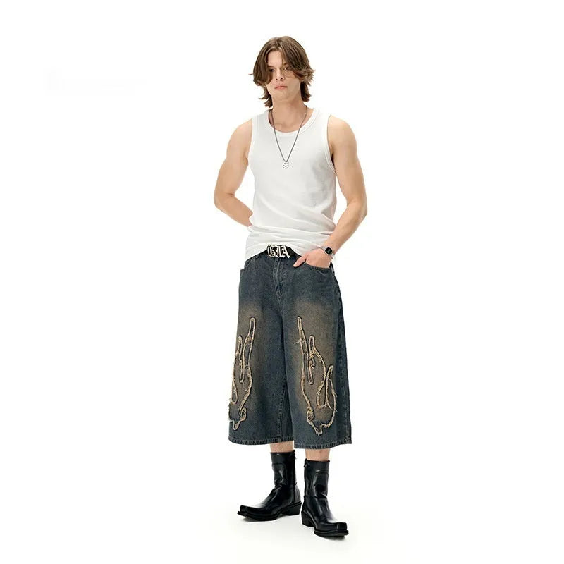 Men's black cotton denim shorts with flame embroidery patches and straight fit cut
