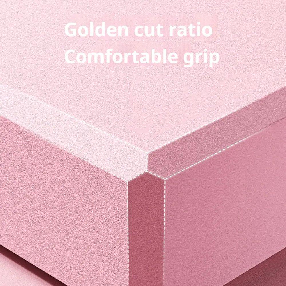Solid colour high-density EVA foam yoga block with ridged sides on a gym mat