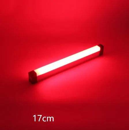 Rechargeable dimmable LED tube light in blue and purple colours shown in a bedroom setting.