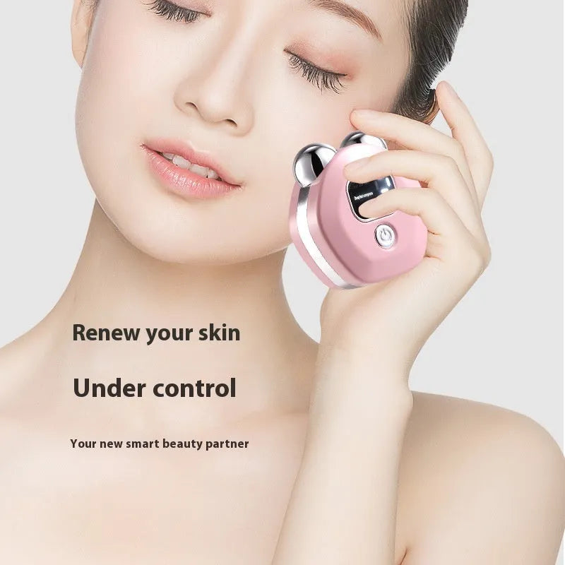 Portable white hot compress and micro current double-roller facial massage instrument with USB charging cable