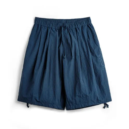 Men's loose fit embroidered beach shorts in Prussian Blue with thin nylon fabric