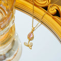 Gold electroplated titanium steel tulip necklace with adjustable chain and floral pendant
