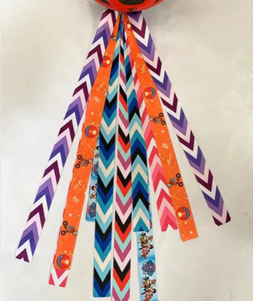 Children's decorative helmet streamer ribbon in multiple colours for roller skating and skiing safety gear.