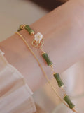 Natural olivine double layer bracelet with Bells of Ireland charms and olive branch detailing