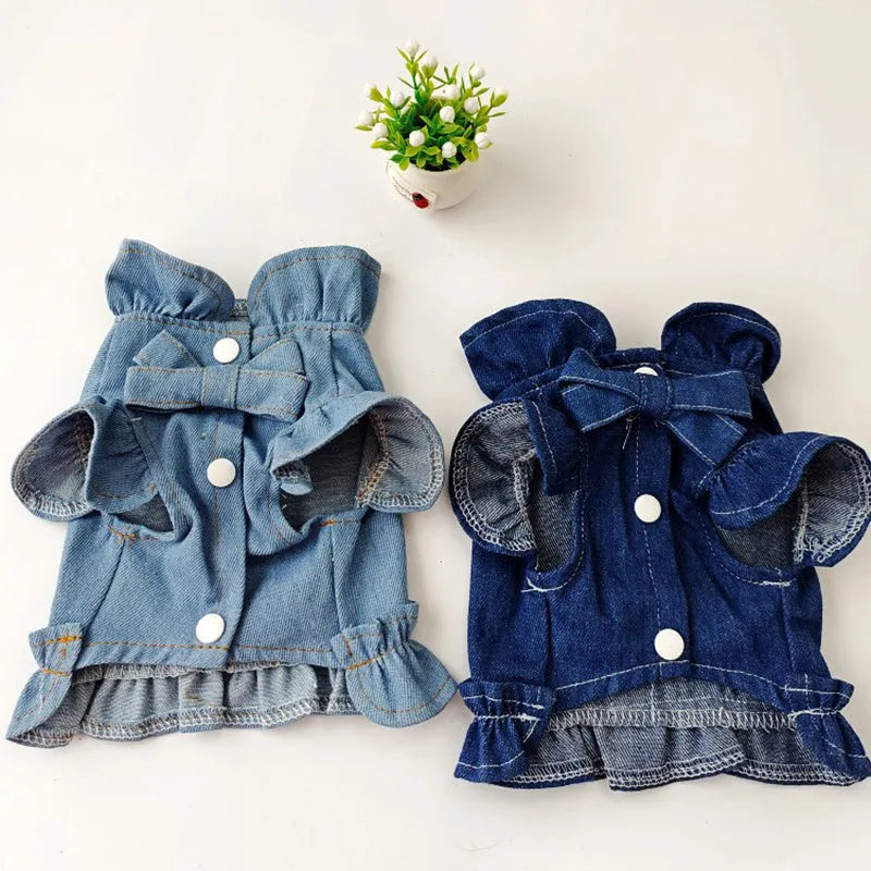 Blue denim pet dress with ruffle trim and leash hook attachments on chest and back
