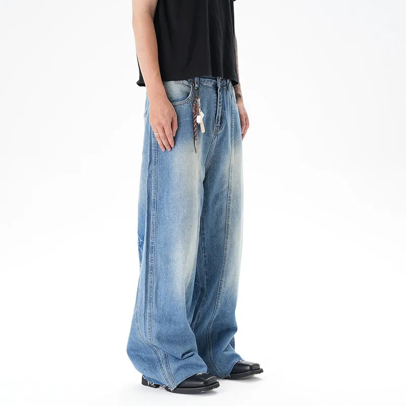 Light blue washed vintage women's wide leg jeans with a machete cut design on a front zip fly.