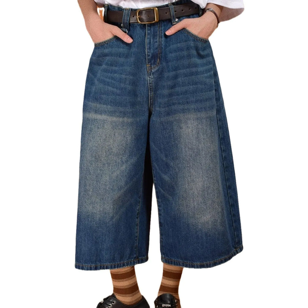 Men's straight-leg loose fit denim shorts in light blue on a neutral background.
