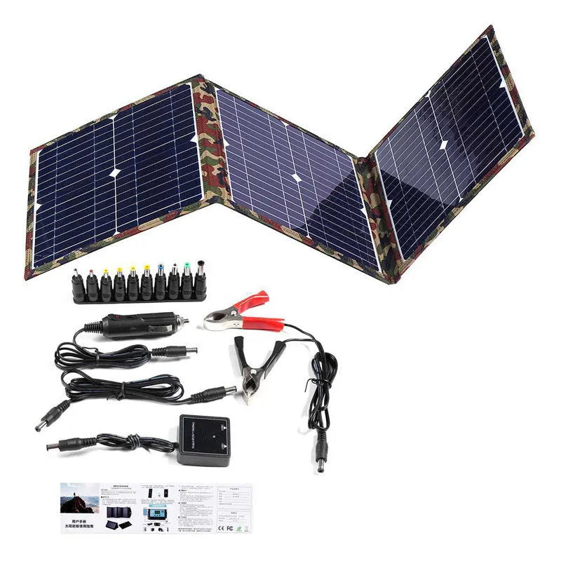 Black foldable solar panel unfolded showing three monocrystalline solar cells, with accessories including car charger and USB box