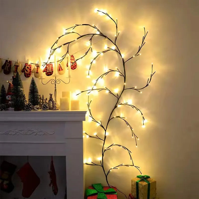 Flexible LED willow vine garland with warm white lights on birch-textured branches for wall and party decor.
