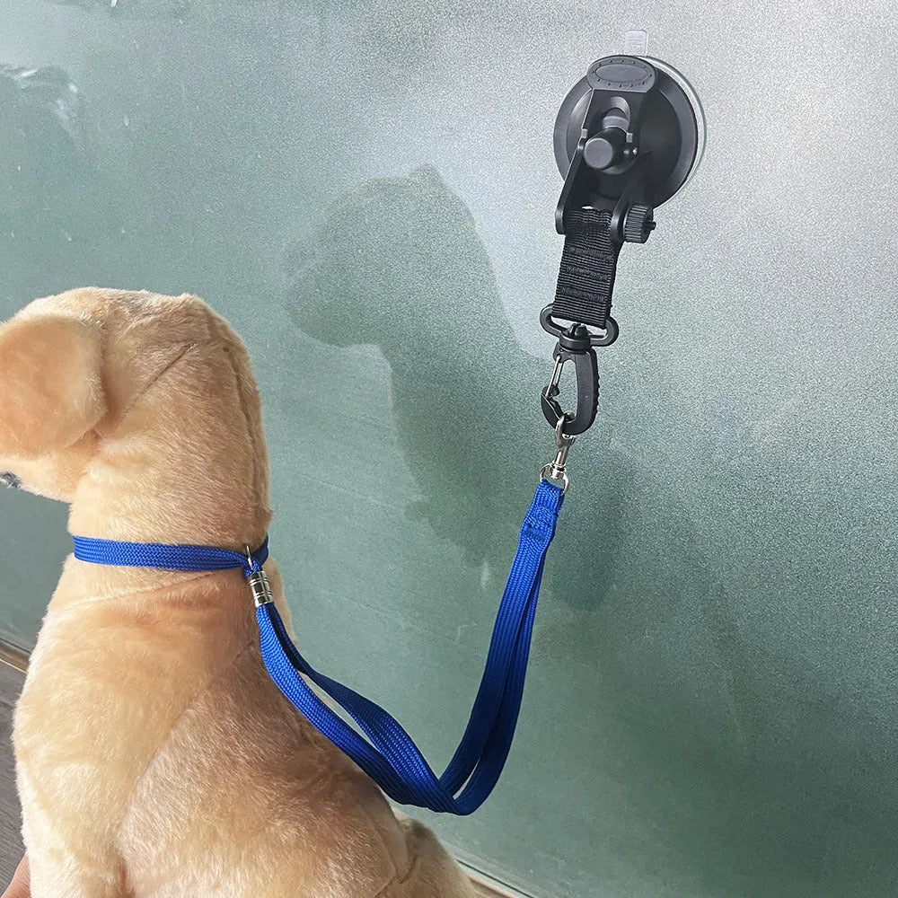 Pet bathing restraint kit with suction cups, traction rope, and handcuffs in black or blue.
