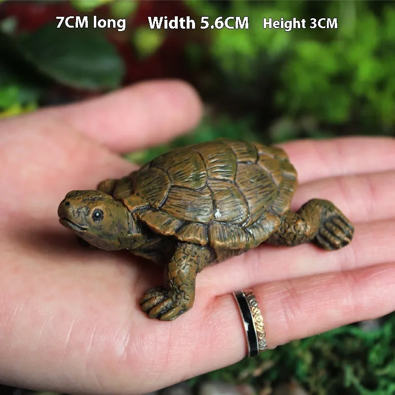 Realistic simulated turtle resin ornament for garden and terrarium decoration.