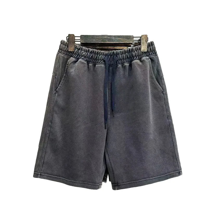 Men's loose-fit cotton casual shorts in distressed style, shown in charcoal black.