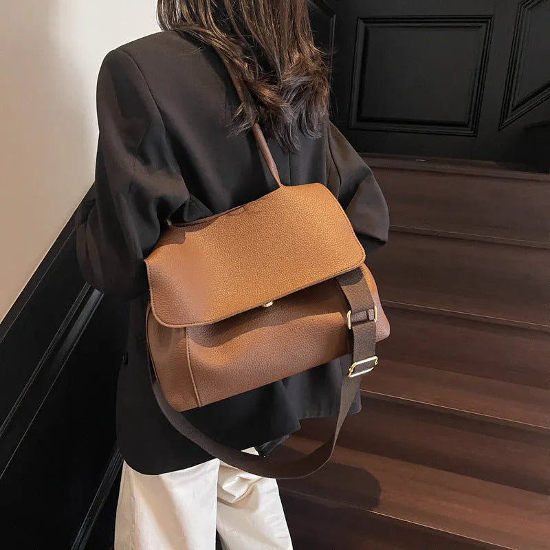 Square synthetic leather tote bag with double straps in a neutral colour.