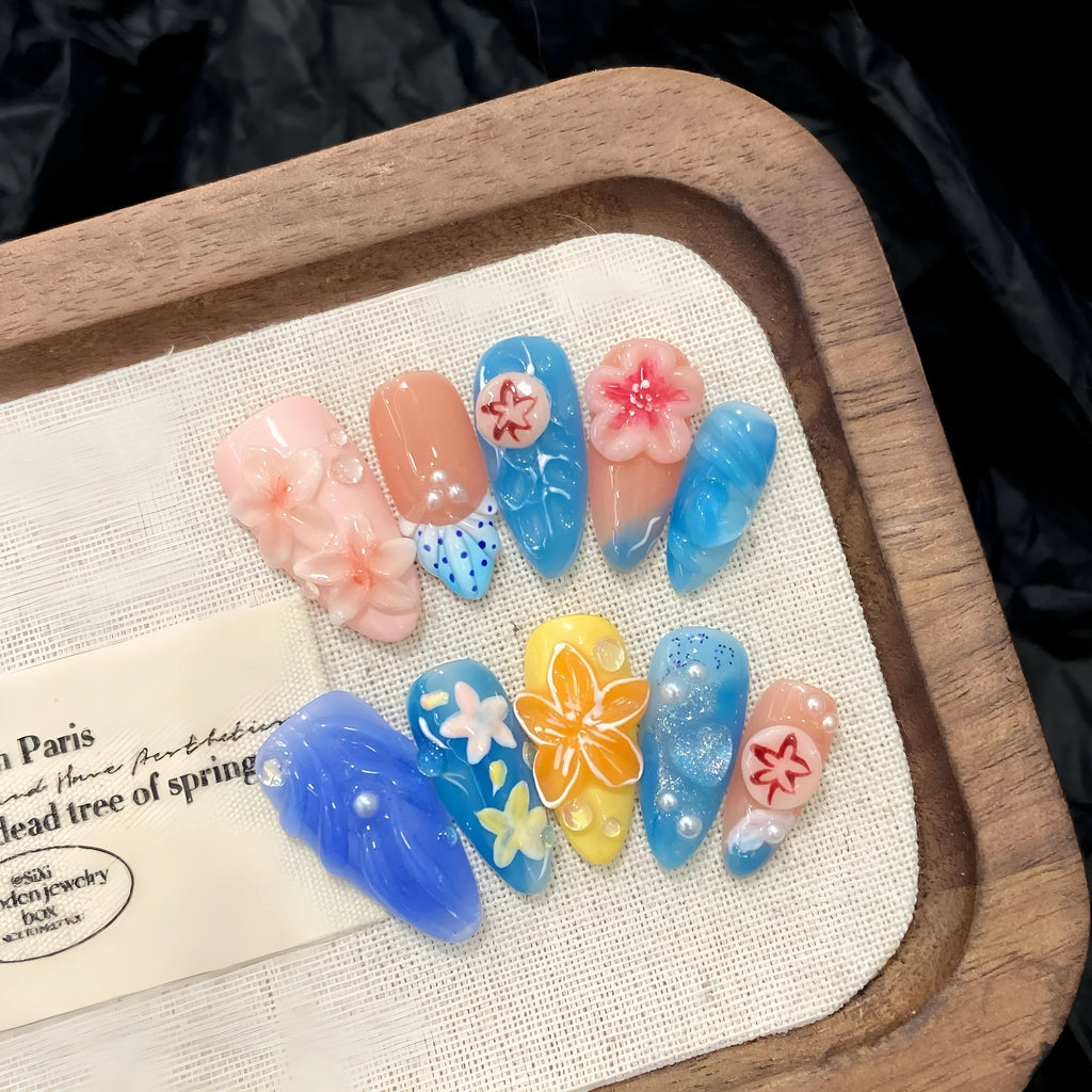 Three-dimensional carved jellyfish design on plastic marine-style wearable armour in almond nail colour.