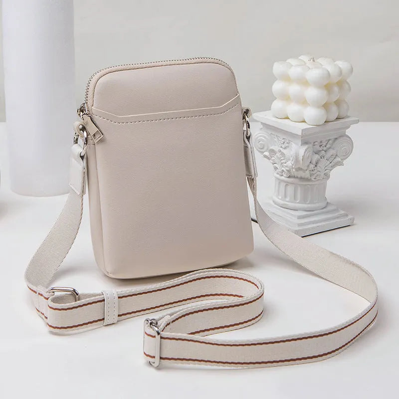 Small solid-colour PU crossbody shoulder bag for mobile phone.