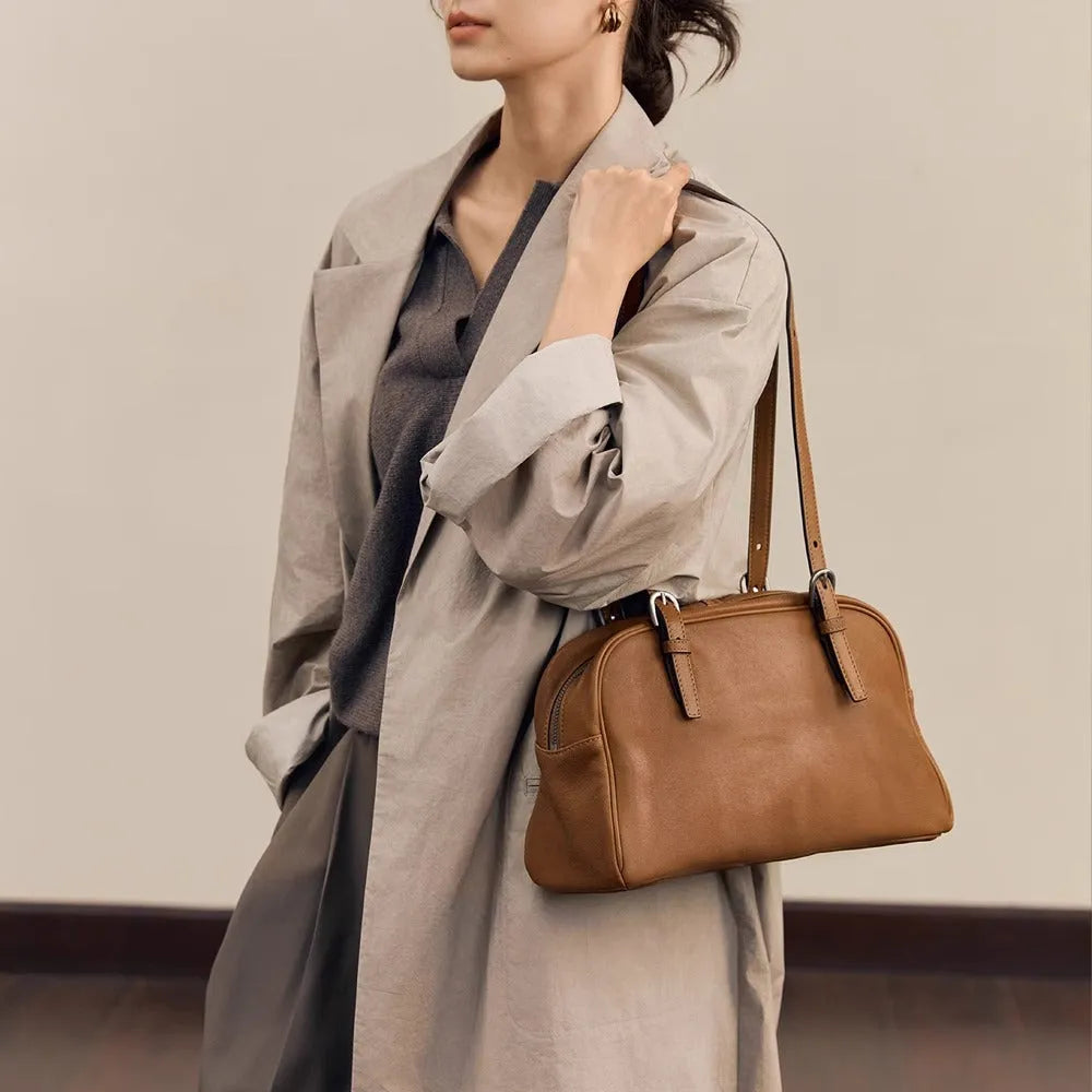 Women's black genuine leather retro shoulder bag showing horizontal square shape and double shoulder straps