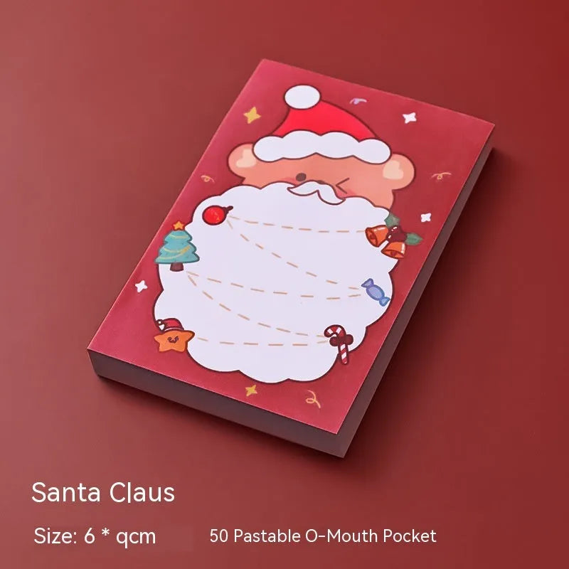 Christmas sticky notes book showing cartoon designs of Elf, Gift, Sled, Ball, Santa, House, Bear, and Snowman