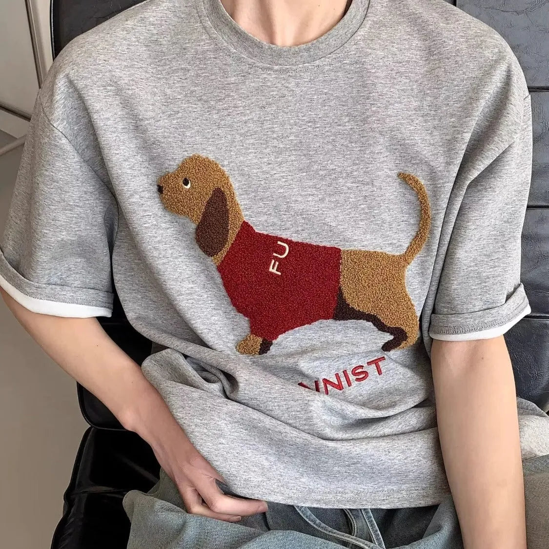 Men's grey cotton T-shirt with embroidered sausage dog design on the front.