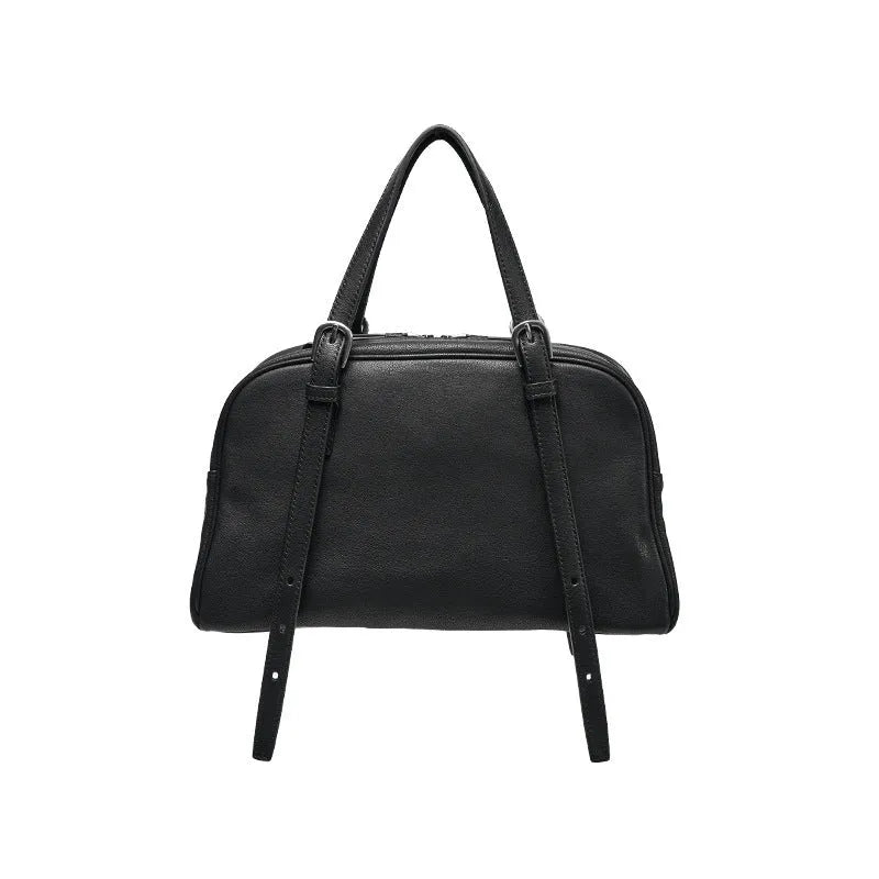 Women's black genuine leather retro shoulder bag showing horizontal square shape and double shoulder straps