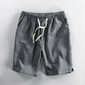 Men's striped casual shorts in loose straight-leg fit with elastic waistband.