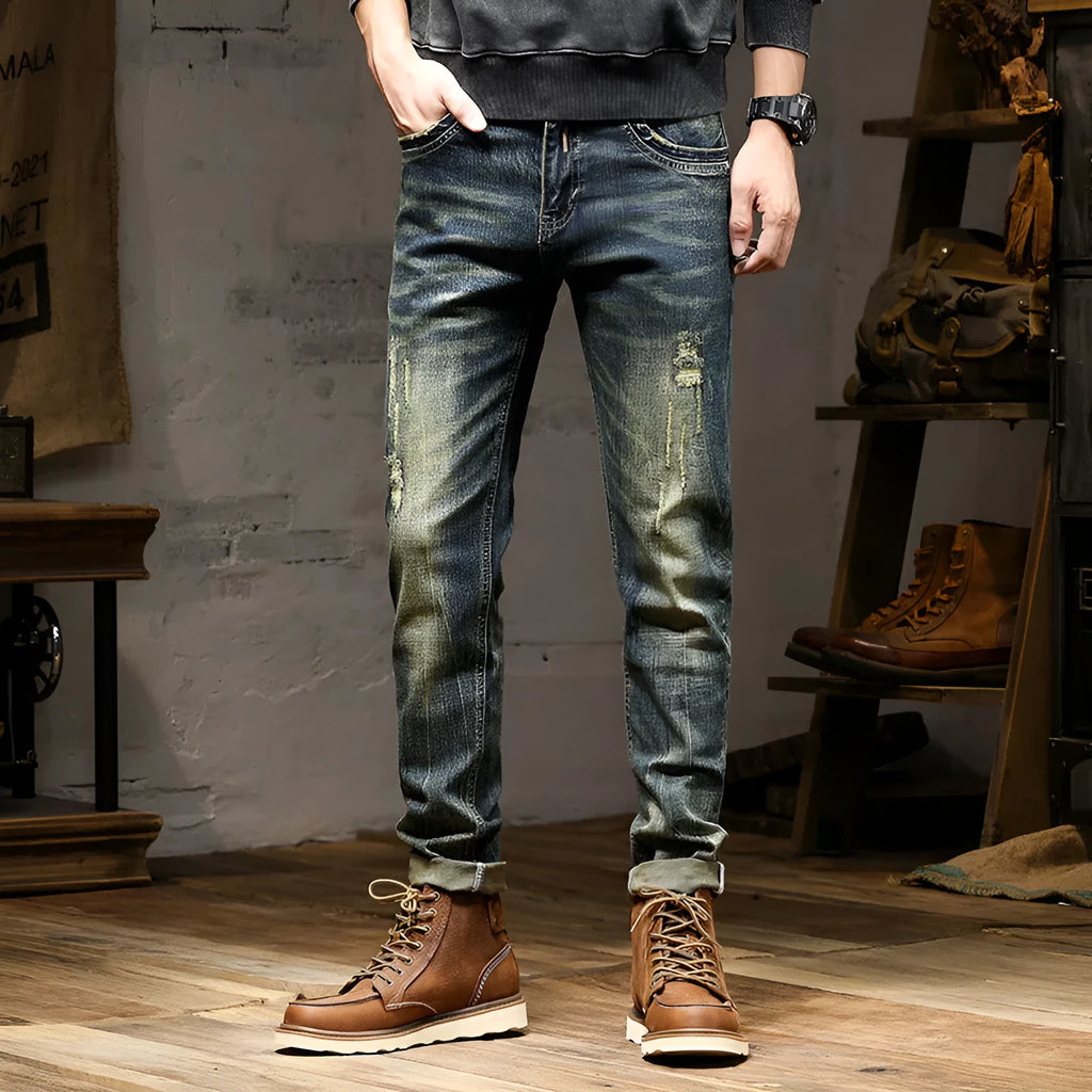 Men's skinny jeans in retro colour with zip fly, showing stretch denim fabric and slim pencil pants cut