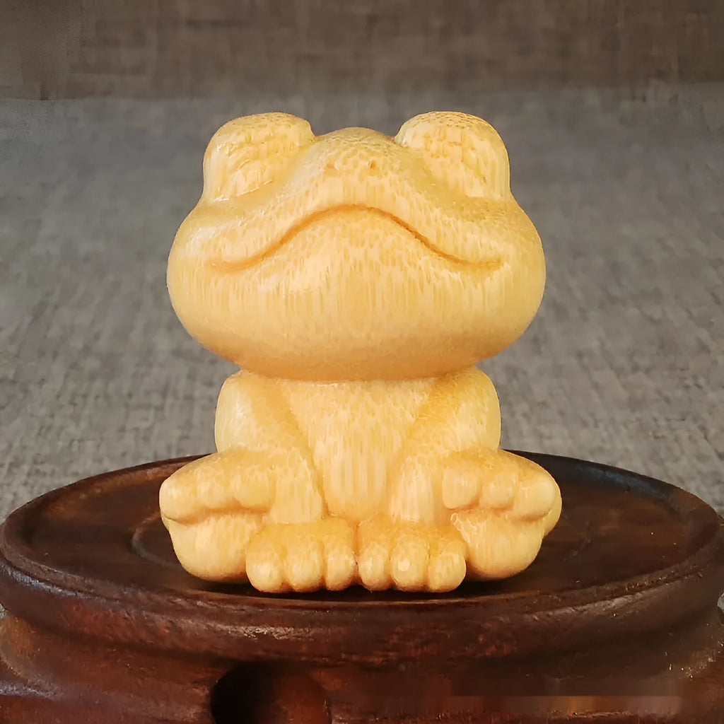 Solid bamboo smiling frog carving ornament measuring 5cm tall with cartoon design