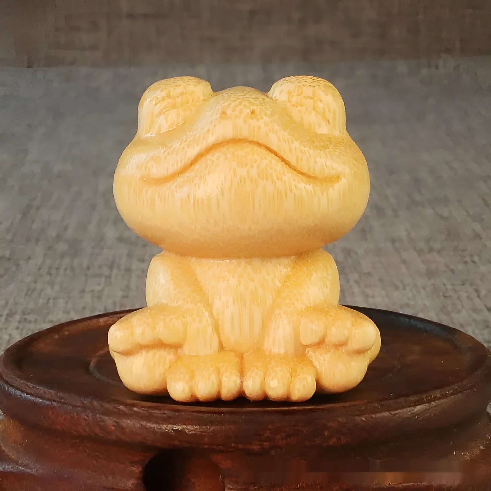 Solid bamboo smiling frog carving ornament measuring 5cm tall with cartoon design