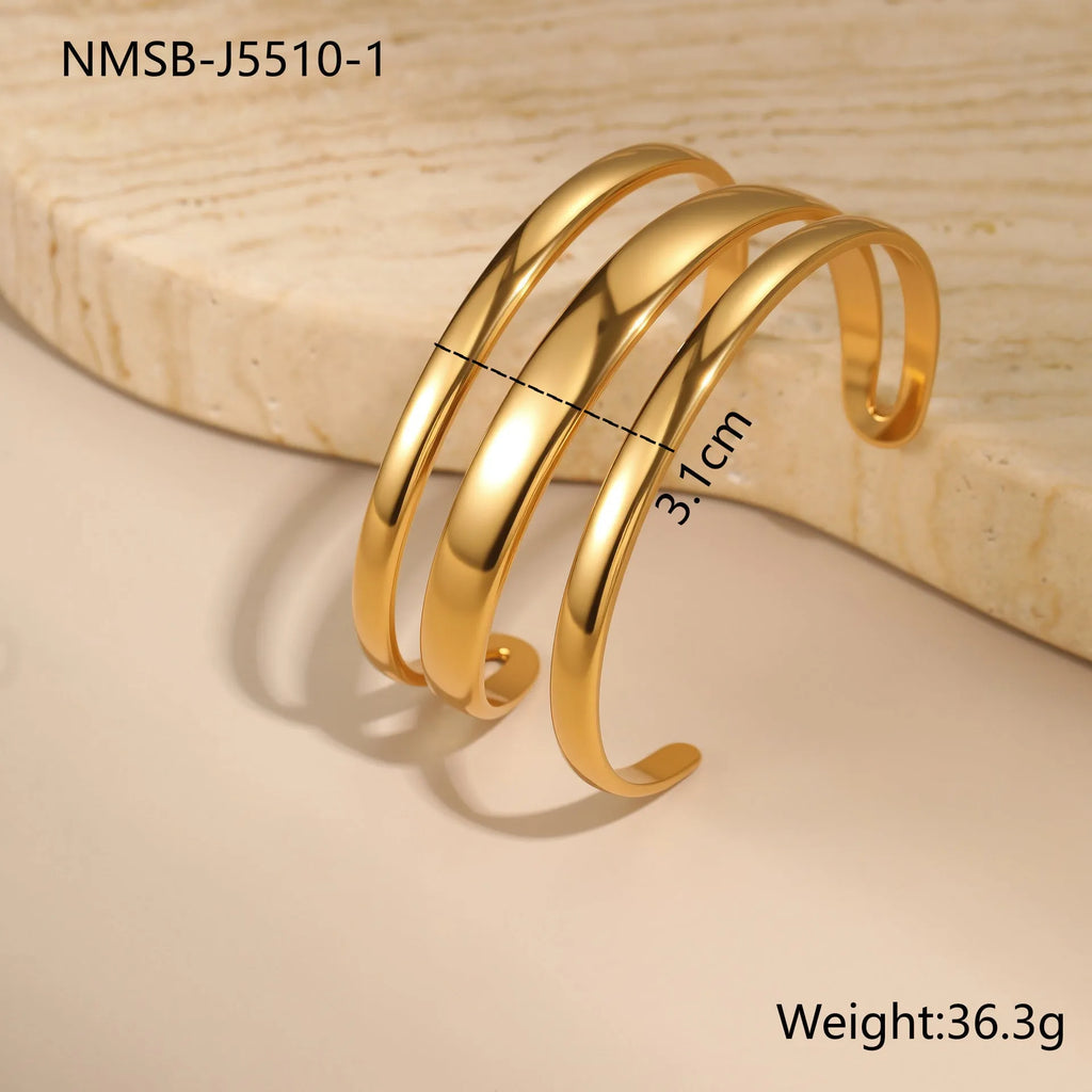 A geometric line design stainless steel bracelet with a simple opening clasp, shown in a gold electroplated finish.